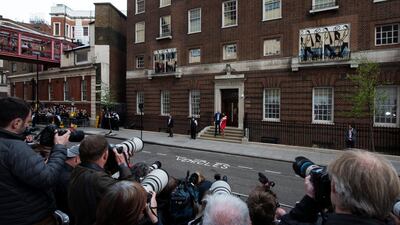Britain's Prince William (L), Duke of Cambridge stands next to his wife Catherine (R), Duchess of Cambridge who holds their newborn son outside the Lindo Wing at St. Mary's Hospital, 23 April 2018. (EPA/WILL OLIVER)