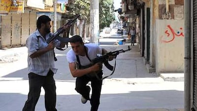 Fighters from the Syrian opposition clash with forces loyal to President Bashar Al Assad, in the centre of Syria's restive northern city of Aleppo.