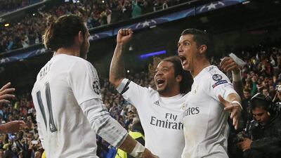 Real Madrid’s Cristiano Ronaldo celebrates scoring their third goal and his hat-trick with Marcelo and Gareth Bale. Reuters / Juan Medina