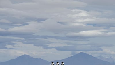 Dakar rally director Etienne Lavigne and sport director of the Dakar Rally, French David Castera ride through the Salar de Uyuni salt pan in Bolivia near the crest of the Andes as they scout locations for the 2015 Dakar Rally last week. Franck Fife / AFP / September 18, 2014
