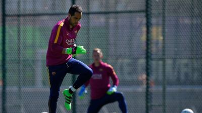 Barcelona’s Chilean goalkeeper Claudio Bravo takes part in training session at the FC Barcelona Joan Gamper Sports Centre in Sant Joan Despi, near Barcelona on April 16, 2015, on the eve of the La Liga match FC Barcelona v Valencia CF. AFP / LLUIS GENE