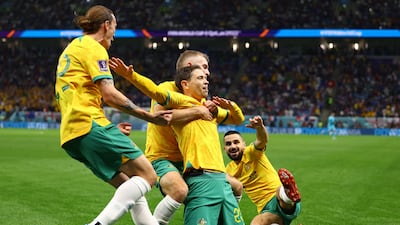 Australia's Craig Goodwin celebrates scoring their first goal with Riley McGree, Jackson Irvine and Aziz Behich. Reuters