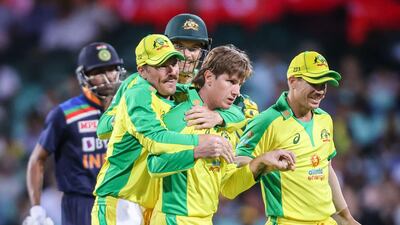 Australia's Adam Zampa, centre, celebrates after dismissing India’s Shikhar Dhawan during the first ODI in Sydney on Friday. AFP