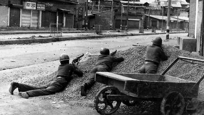 Indian policemen taking aim in 1989 after Kashmiri militants opened fire on government forces in Srinagar. Kashmir remains a bone of contention between India and Pakistan. Habib Naqash / AFP