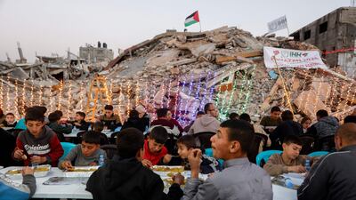Palestinians gather for a mass fast-breaking iftar meal. AFP