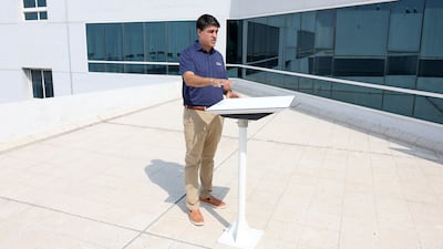 Jimmy Grewal, managing director for Dubai-based Elcome, shows off a Starlink connectivity device. Chris Whiteoak / The National