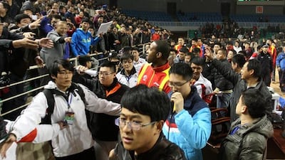 Fans make their point to Tracy McGrady after the match was stopped following angry scenes. Pic: AFP