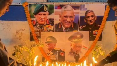 People light candles to pay their respect to defence chief Gen Bipin Rawat in Siliguri on December 8, 2021 after reports of a helicopter crash in which he and his wife were among 13 casualties. AFP