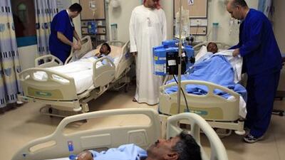 More than 100 cases of food poisoning among workers at a labour camp caused a state of emergency at Madinat Zayed Hospital in the Western Region.