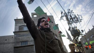 A Palestinian chants slogans during a demonstration against chronic power cuts in Jabaliya refugee camp in the northern Gaza Strip on January 12, 2017. Khalil Hamra / AP Photo