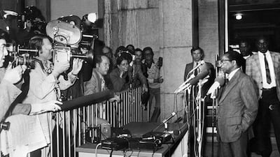 Patriotic Front leader Robert Mugabe, right, gives a press conference, on October 29, 1976 in Geneva. AFP