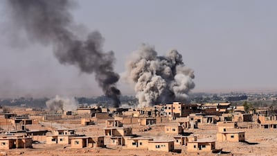 Smoke rises from buildings in the area of Bughayliyah, on the northern outskirts of Deir Ezzor. AFP