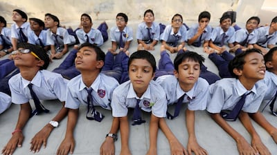 Students in Ahmedabad practise yoga ahead of International Day of Yoga on June 17, 2015. India’s supreme court on November 8, 2016 began hearing a plea to make the practice of yoga compulsory in all state schools. Amit Dave / Reuters