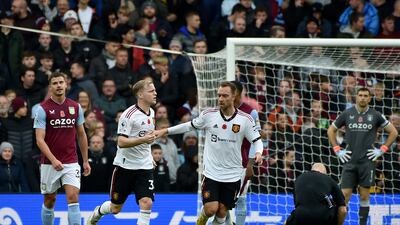 Donny van de Beek and Christian Eriksen celebrate United's strike, an own goal. AP
