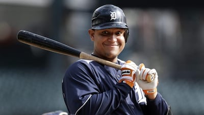 Detroit Tigers' Miguel Cabrera smiles at catcher Gerald Laird after a pitch during a workout at Comerica Park in Detroit on Monday, Oct. 22, 2012. AP Photo/Paul Sancya