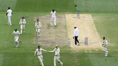 Nathan Lyon is congratulated after getting the wicket of Kagiso Rabada. Getty