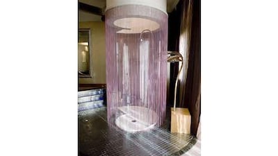 Shangri-La's Villa Das Island includes a shower with a 360-degree beaded curtain in the master bedroom.