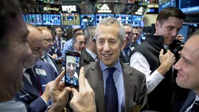 Shake Shack founder Danny Meyer, centre, is photographed during his company’s debut on the floor of the New York Stock Exchange. Brendan McDermid / Reuters