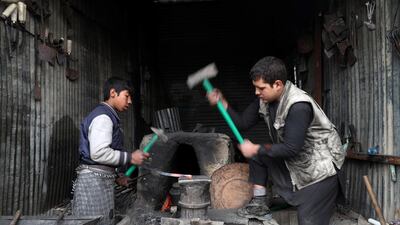Blacksmiths work at their shop in Kabul, Afghanistan. REUTERS