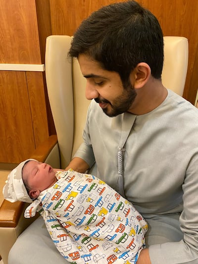 Baby Abdullah with his father, Ali Al Shehhi. The boy was the first baby born at Danat Al Emarat Hospital in the New Year - at 1.01am. Courtesy Danat Al Emarat