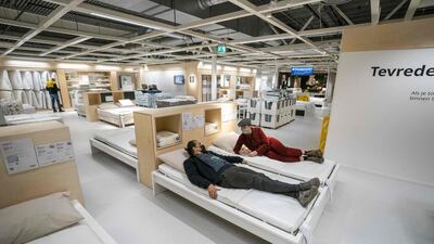 Customers makes purchases at an IKEA store in Amsterdam, the Netherlands. Due to the lifting of some coronavirus restrictions, stores can receive a maximum of 50 customers per time slot instead of two. AFP