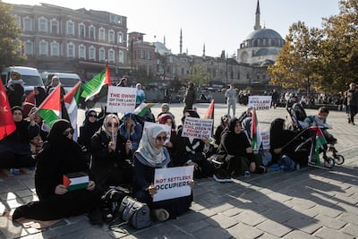 Women sit for a pro-Palestine protest in Eminonu square on October 20, 2023 in Istanbul, Turkey. Getty Images