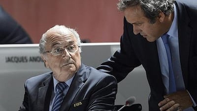 Sepp Blatter, left, and Michel Platini have been banned for eight years. Fabrice Coffrini / AFP