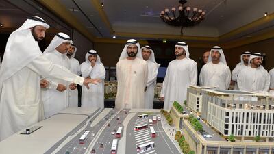 Sheikh Mohammed inspects the projects on display by Investment Corporation of Dubai. Wam