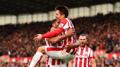 Stoke City’s Bojan Krkic celebrates with Marko Arnautovic after scoring against Manchester United on Saturday. Laurence Griffiths / Getty Images
