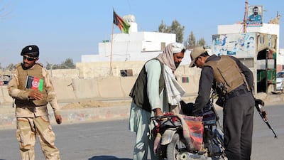 Afghan security officials check people and vehicles at a checkpoint in Helmand, Afghanistan, 24 January 2019. EPA
