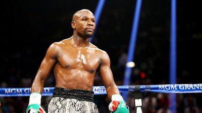 Former champion Mike Tyson says Floyd Mayweather may want to consider a different approach to fighting Manny Pacquiao and stay away from his usual conservative style. Al Bello / Getty Images