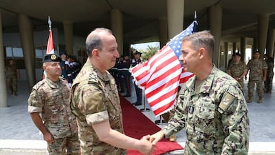 Lebanese army chief Rodolphe Haykal greets Admiral Brad Cooper, right, commander of US Central Command, at the Lebanese Ministry of Defence in Yarze on Monday. Lebanese Army Press Office / AFP