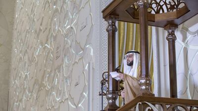 Khalifa Al Dhaheri, Imam at the Sheikh Zayed Grand Mosque, right, delivers a sermon during Eid Al Adha prayers at the Sheikh Zayed Grand Mosque. Ryan Carter / Crown Prince Court - Abu Dhabi
