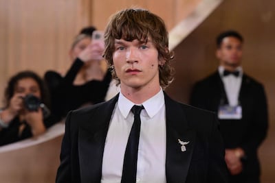 Connor Storrie sports a mullet on the red carpet. AFP
