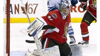 Craig Anderson makes a save on his way to a shutout victory in his first game for Ottawa. Chris Young / AP Photo