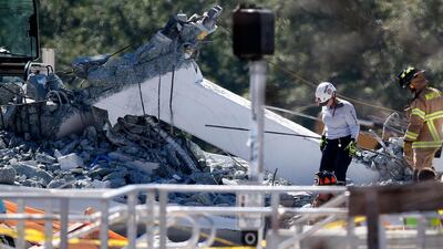 The bridge had only been installed a week ago,, ahead if its planned opening in 2019. Wilfredo Lee / AP Photo