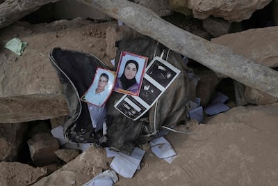 Photos lie in the rubble of earthquake-hit homes in a Moroccan village. Whereas Morocco operates under a unified government that can respond to disasters, Libya remains divided between rival centres of power. AFP