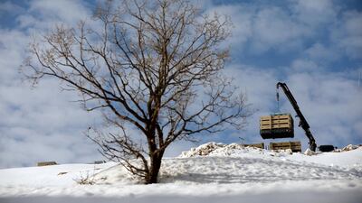 A crane lowers Iron Dome anti-missile system launch tubes at Mount Hermon in the Israeli-occupied Golan Heights near the Israel-Syria border. Reuters