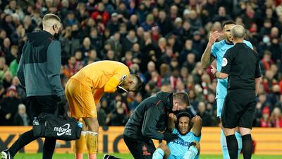Newcastle's Isaac Hayden is injured during the Premier League match against home side Liverpool on Thursday night. AP