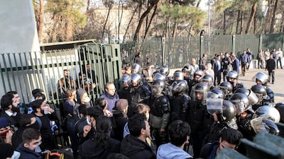 This photo shows anti-riot police preventing university students from joining other protesters in Tehran, Iran on December 30. AP