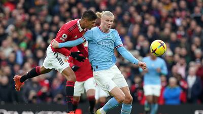 Manchester United's Raphael Varane battles with Manchester City's Erling Haaland in the derby. PA