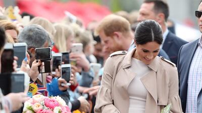 In a Brandon Maxwell dress and a silk Burberry trench, with Stuart Weitzman shoes, during a public walkabout at the Viaduct Harbour in Auckland on Tuesday October 30. Photo / AFP