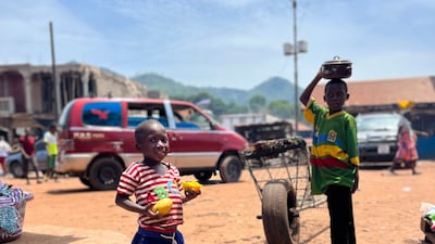 Mangoes are not in short supply in this corner of West Africa, as this young boy tucks into the rich fruit. Nick Webster / The National