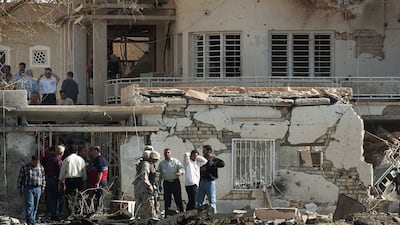 US military personnel and Iraqi security forces investigate the scene of a deadly car bomb attack on the International Committee of the Red Cross HQ in October 2003, in Baghdad. Getty Images