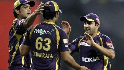 Kolkata Knight Riders' Gautam Gambhir, right, and Laxmi Ratan Shukla, left, celebrate the dismissal of Pune Warriors' Manish Pandey during their IPL win.