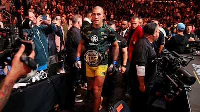Alex Pereira leaves the octagon with the light-heavyweight championship belt after beating Jiri Prochazka. USA Today