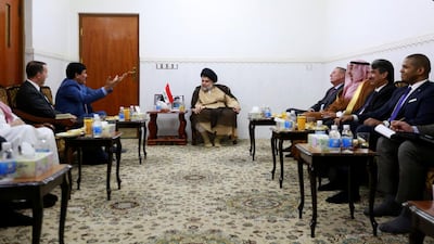 Iraqi Shiite cleric Moqtada Al Sadr meets with ambassadors from Turkey, Jordan, Saudi Arabia, Syria and Kuwait, in Najaf, Iraq, on Saturday. Reuters