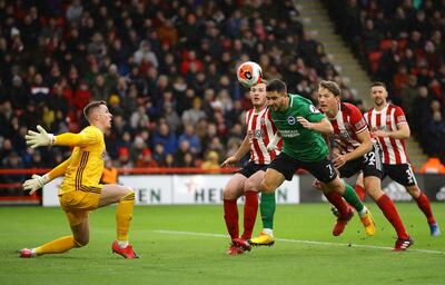 Brighton's Neal Maupay heads home the equaliser against Sheffield United. Getty