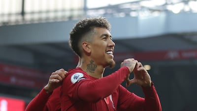 Liverpool's Roberto Firmino celebrates scoring the first goal. Reuters