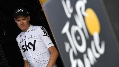 In this file photo taken on July 06, 2017 Britain's Chris Froome arrives on the podium to celebrate his overall leader yellow jersey at the end of the 216km sixth stage of the 2017 Tour de France. Lionel Bonaventure / AFP